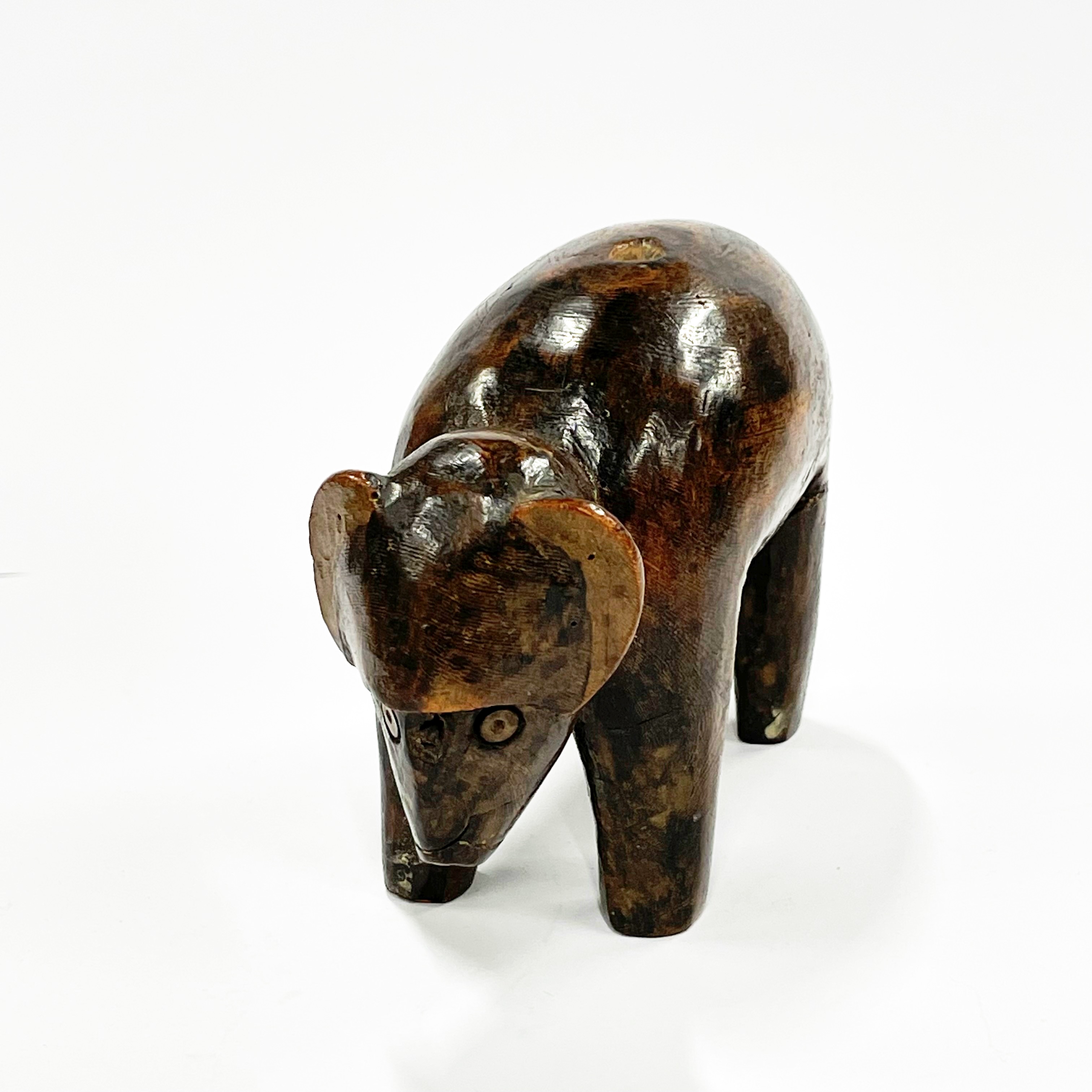 A 19th / early 20th century African tribal carved wooden bull figure, L. 18cm, H. 12cm. Some - Image 2 of 4