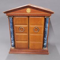 A coin collector's cabinet of Millenium coin collection documented ancient coins.