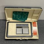 A boxed electronic Bridge Challenger game.