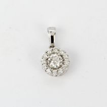 A hallmarked 18ct white gold diamond set pendant, estimated approx. 0.28ct centre stone, L. 1.5cm.