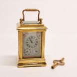 A miniature gilt brass and porcelain carriage clock, H. 10cm.