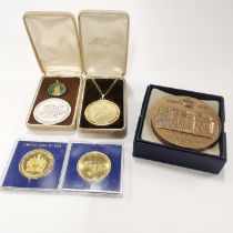 A group of mixed coin related items.