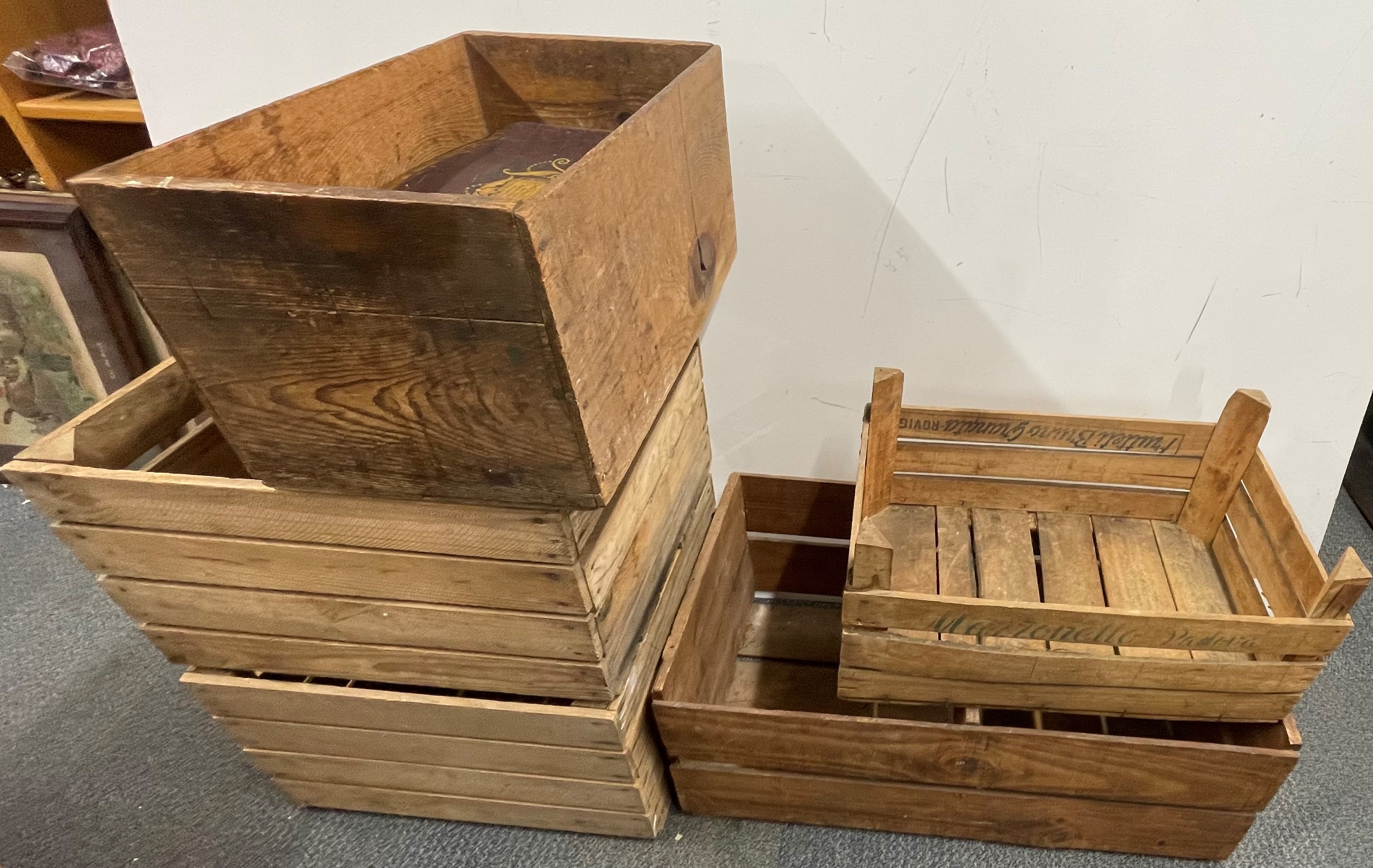 A group of five vintage wooden crates, largest 74 x 38 x 29cm, and tins.