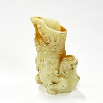 A large Chinese archaic form jade wine cup, H. 21cm.