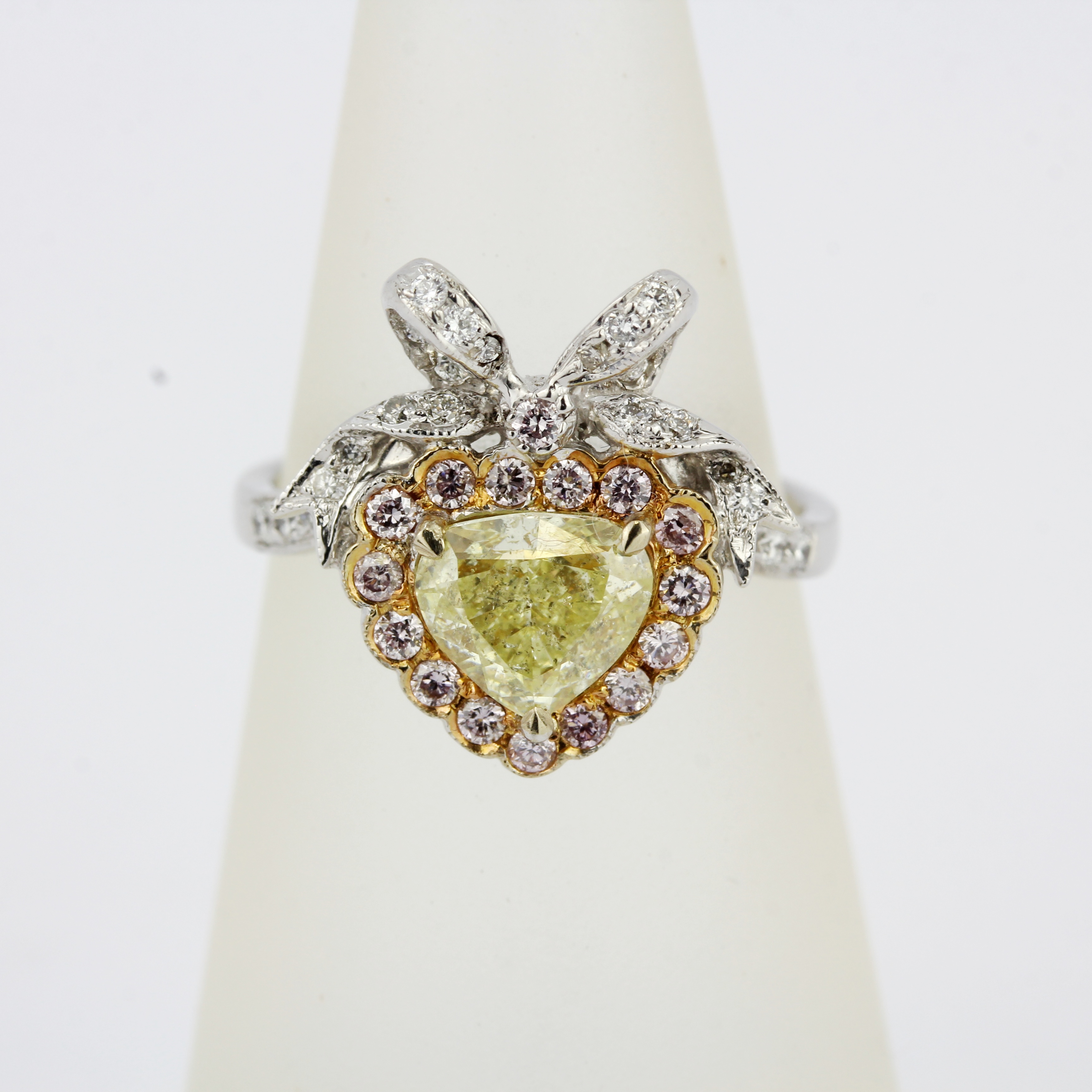 An 18ct white gold ring set with a heart brilliant cut fancy yellow diamond, surrounded by pink - Image 4 of 5