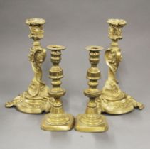 A pair of ornate brass candlesticks and a further pair of 19thC candlesticks, tallest H. 26cm.