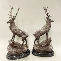 A pair of large bronze figures of stags after J. Moignier on black marble bases, H. 74cm.