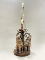 An carved wood effect vintage elephant table lamp, H. 69cm.