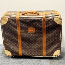 A large vintage leather finished Louis Vuitton suitcase, 72 x 54 x 24cm.