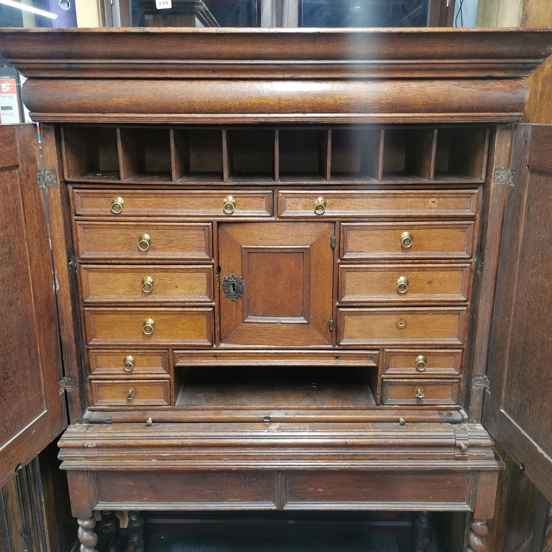 A thirteen drawer oak Cromwellian style cabinet desk with a pull out writing platform and a large - Image 2 of 6