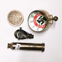 Four reproduction German Nazi items, including a telescope, compass , clock and monocular.
