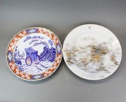 A continental Imari style charger together with a further oriental design charger, largest dia.