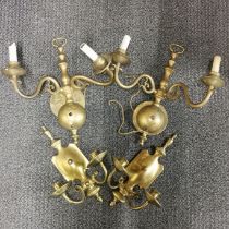 Two pairs of brass wall lights.