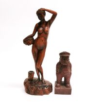 A carved wooden figure of a naked girl, H. 19cm together with a further carved wooden figure of a