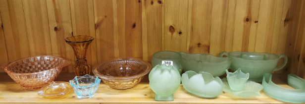 A group of frosted green glass and other coloured glass items.