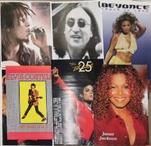 A collection of 17 music posters including Michael Jackson, Janet Jackson, Bob Marley, Elvis