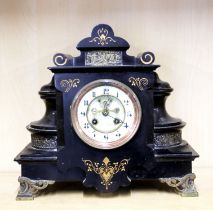 A French slate mantle clock with gilt decoration and porcelain dial, H. 30cm, L. 32cm. Some minor