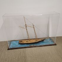 A scratch built cased wooden model of 'The America' 1:32 scale, winner of 1851 cup, built by John