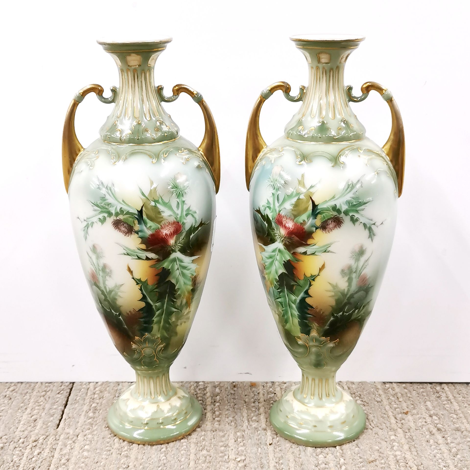 A pair of finely decorated porcelain vases, H. 26cm.