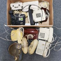 A group of vintage telephones.