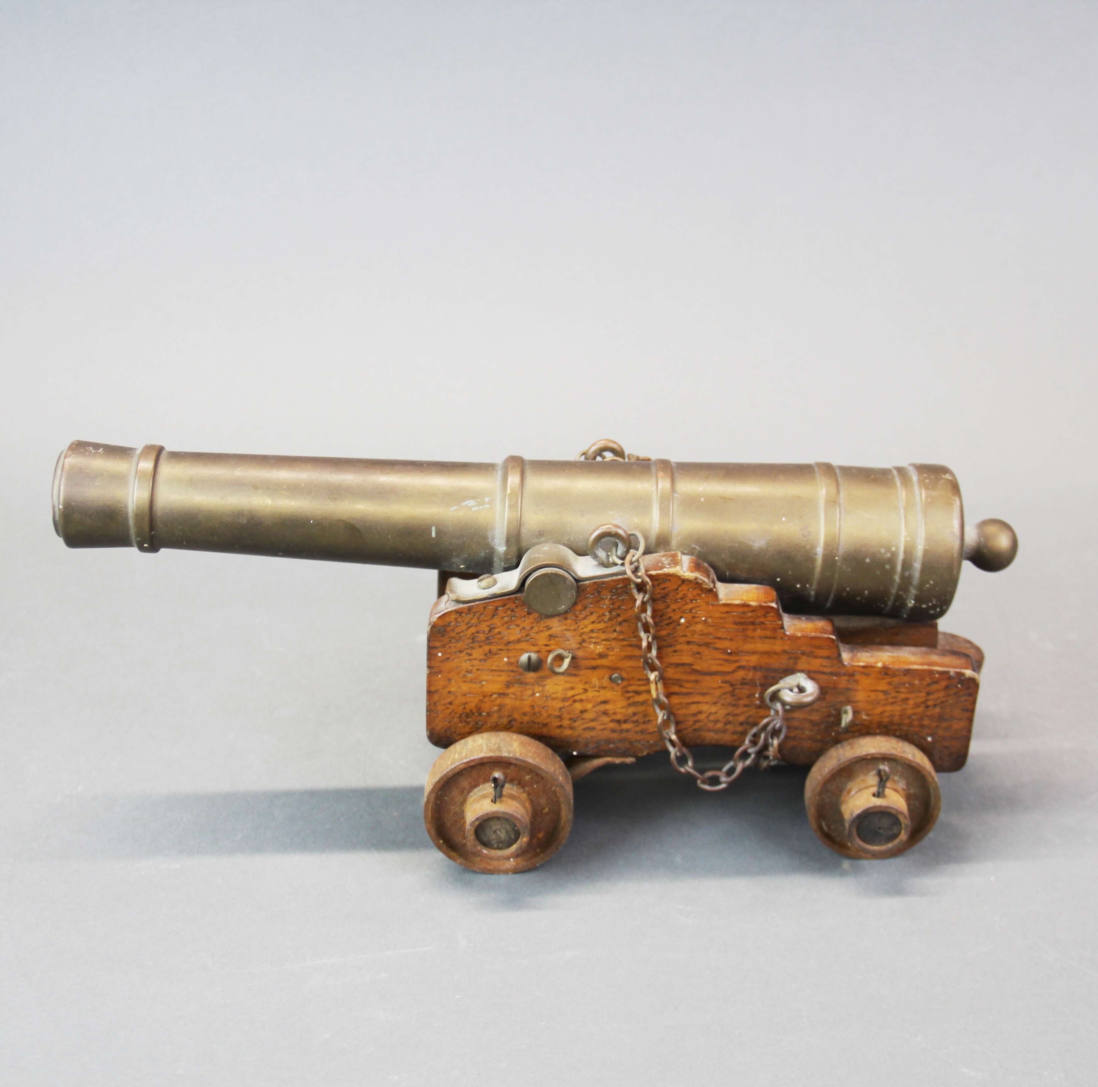 A brass and wood miniature cannon, L. 30cm. - Image 2 of 2