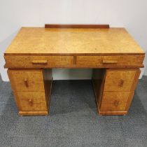A birdseye maple veneered six drawer writing desk, 107 x 75 x 55cm.