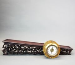 A Chinese rolling gravity clock with wooden ramp, ramp L. 58cm.
