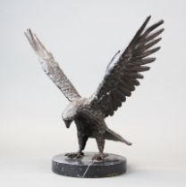 A cast bronze figure of an eagle on a black marble base, H. 31cm.