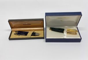 A boxed Shaeffer pen and pencil set with two Waterman pens.