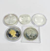 A group of five silver 1oz coins.