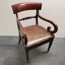 A mahogany and leather elbow chair, H. 88cm.