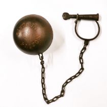 A cast iron reproduction ball and chain. Ball Dia. 15cm.