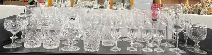 A group of mixed cut glassware.