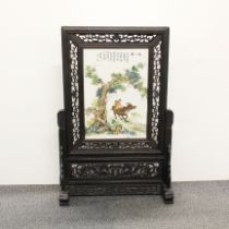 A hand painted Chinese porcelain table screen.