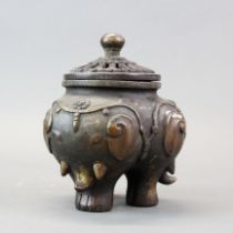 A Chinese bronze three footed elephant censer, H. 19cm.