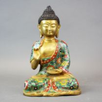 A gilt bronze and enamelled figure of seated Buddha, H. 32cm.