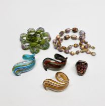 A 1920's Venetian glass necklace together with four venetian glass rings and a brooch.