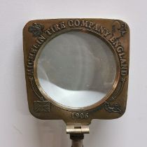 A reproduction glass advertising magnifying glass.