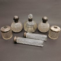A group of 7 silver topped dressing table top items, tallest 18cm.