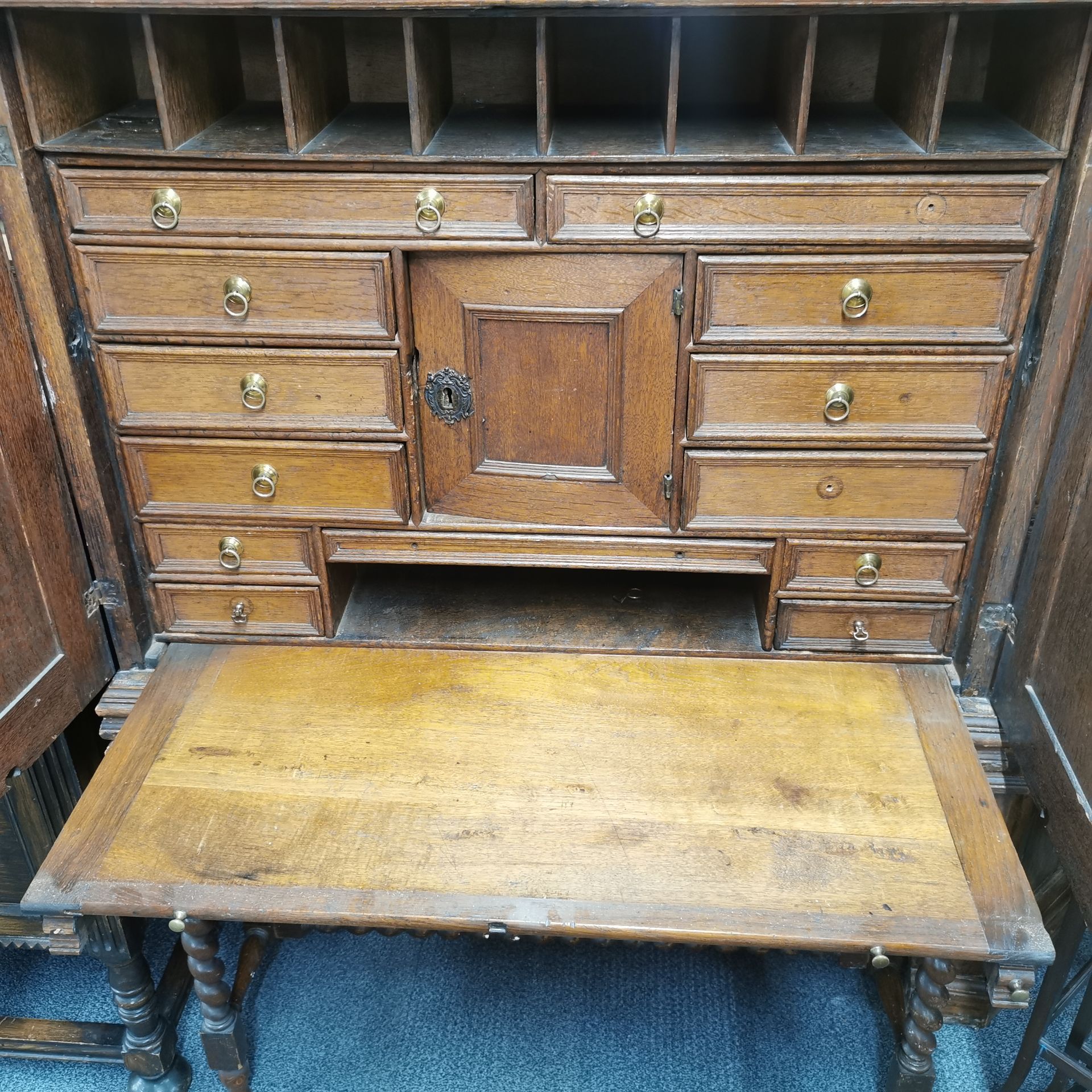 A thirteen drawer oak Cromwellian style cabinet desk with a pull out writing platform and a large - Image 3 of 6