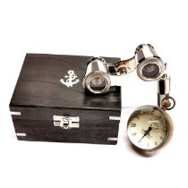 A box containing a pair of opera glasses and an Omega style desk clock paper weight.