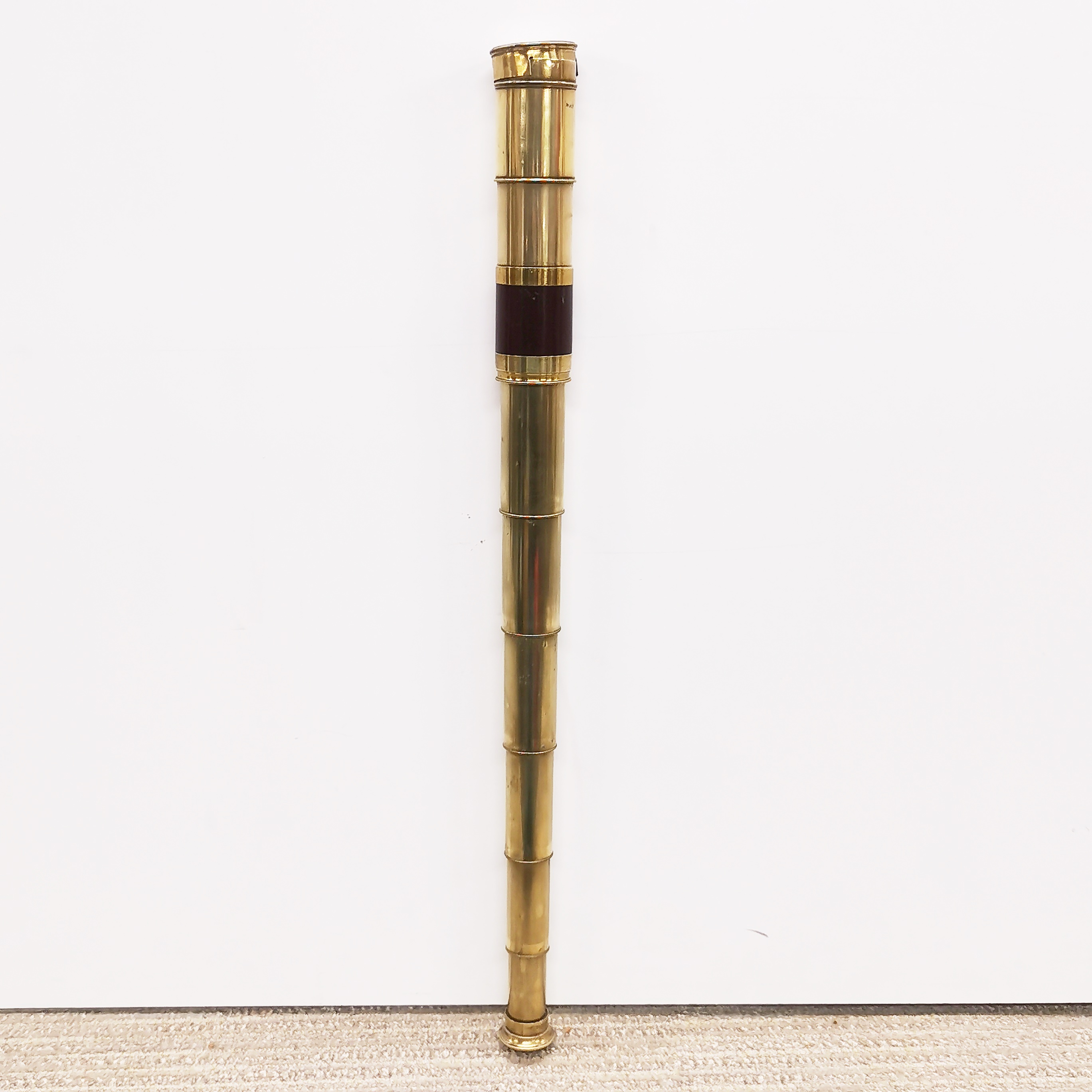 An old brass telescope, closed L. 18cm, Open L. 57cm.