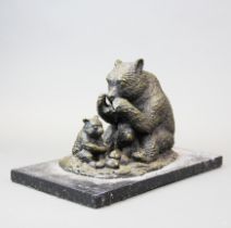 A cast bronze figure of a bear and cub on a black marble base, L. 30cm.