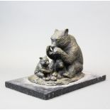 A cast bronze figure of a bear and cub on a black marble base, L. 30cm.