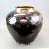 A very large antique Chinese black glazed terracotta vase, H. 45cm, rim dia. 21cm.
