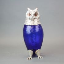 A silverplate and glass owl water jug, H. 28cm.