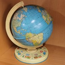 A 1960's tinplate globe, H. 24cm.