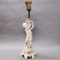 An early 20th century German porcelain figural table lamp base, H. 57cm.