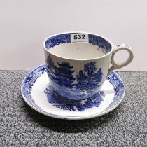 A very large Victorian willow pattern cup and saucer, cup Dia 13cm, H. 10cm.