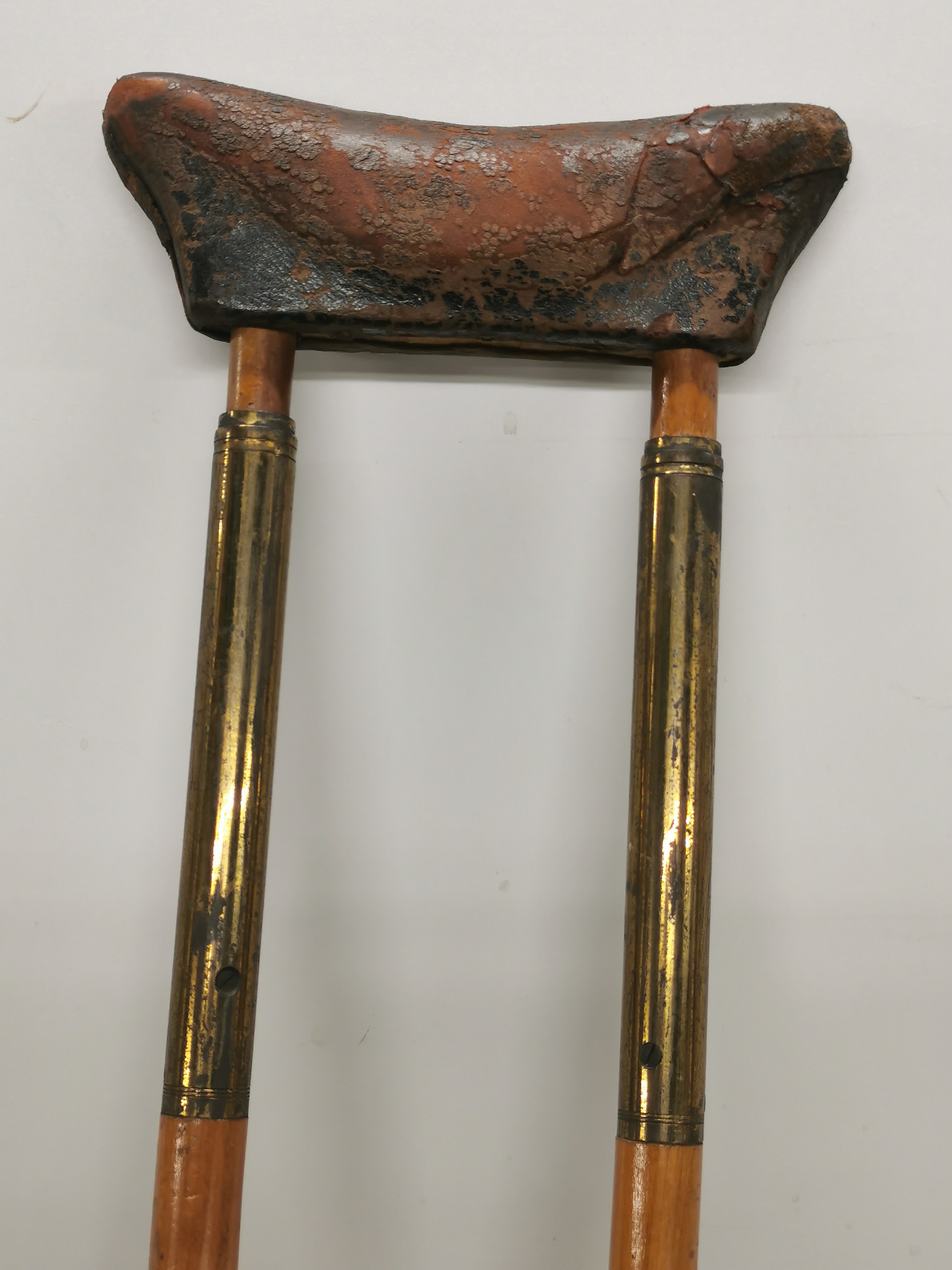 An early brass wood and leather crutch. - Image 4 of 4